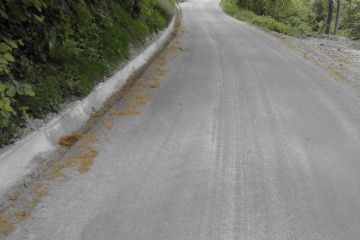 Opere di ripristino a seguito di frana in località Santa Caterina, con scogliera, asfaltatura e canalizzazione delle acque 